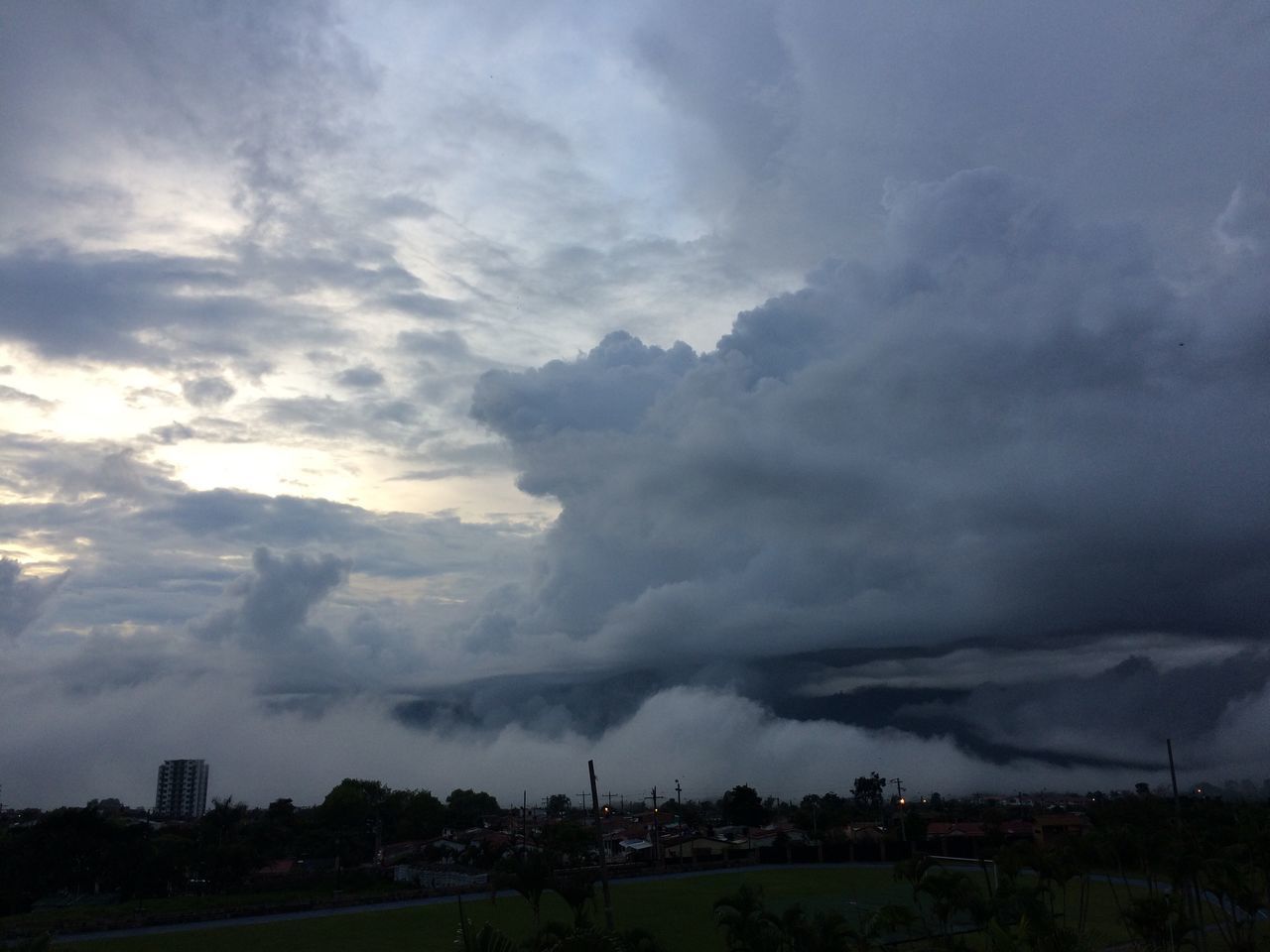 SCENIC VIEW OF STORM CLOUDS OVER BUILDINGS