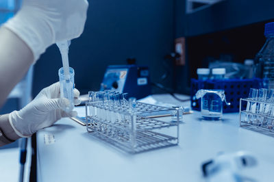 Midsection of scientist working in laboratory