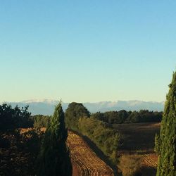 Scenic view of mountains against blue sky