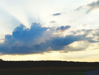 Scenic view of landscape against sky at sunset