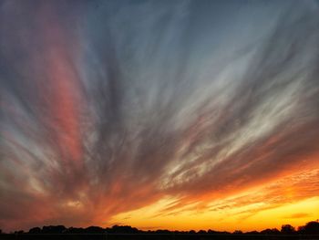 Low angle view of dramatic sky during sunset