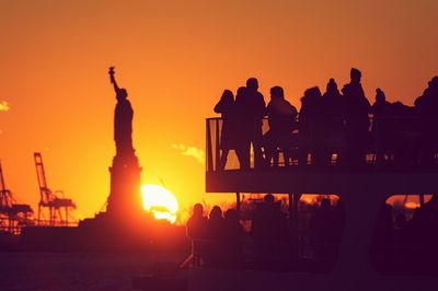 Silhouette of city during sunset