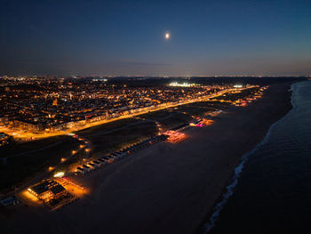 Aerial view of illuminated city at night