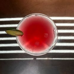 High angle view of red drink on table