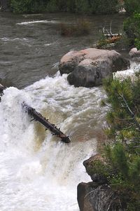 Scenic view of river flowing through rocks