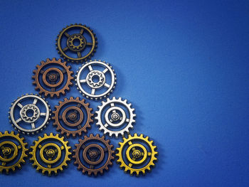 Close-up of clock against blue sky