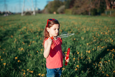 Girl standing on field