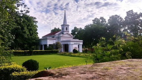 View of temple against building