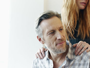 Germany, cologne, mature man and young woman with hands on his shoulders