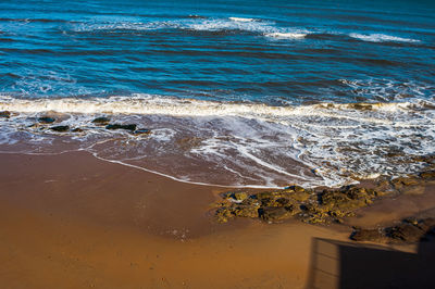 High angle view of surf on beach