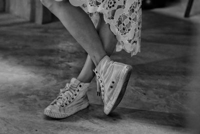 Low section of woman standing on floor