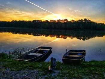 Scenic view of lake against sky during sunset