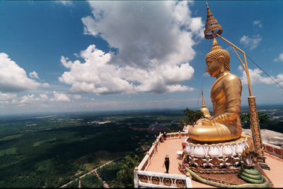 Statue of buddha against sky