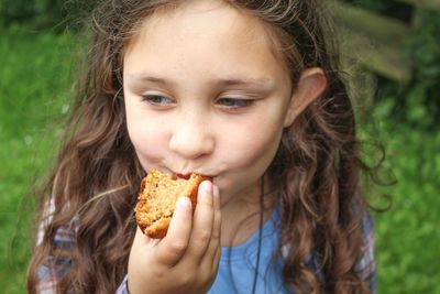 Portrait of girl eating food