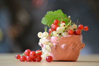 Close-up of red cherries on table