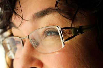 Close-up of woman wearing eyeglasses