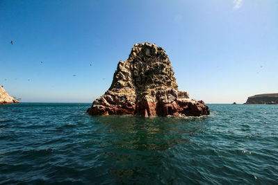 Ballestas islands, paracas, national reserve park. scenic view of sea against sky.