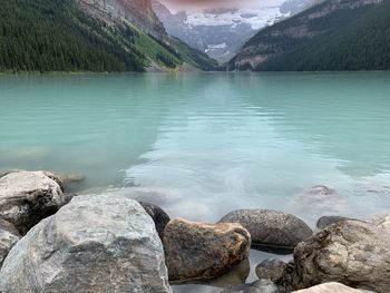 Scenic view of rocks by lake