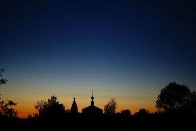 Silhouette temple against sky during sunset