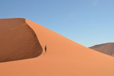 Scenic view of desert against clear sky