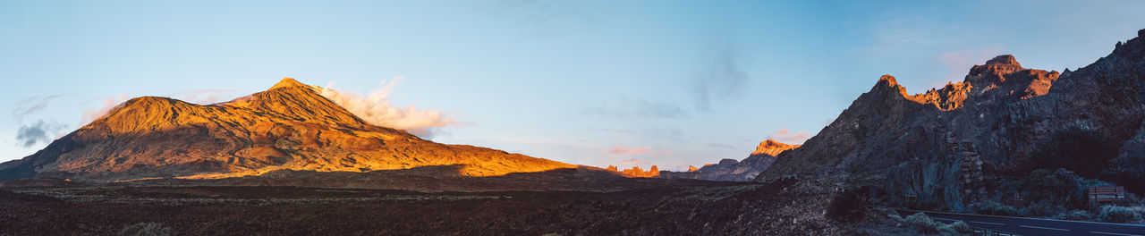 Panoramic view of rocky mountains against sky