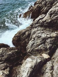 Close-up of rock formation by sea