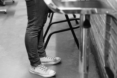 Low section of person standing on floor in city