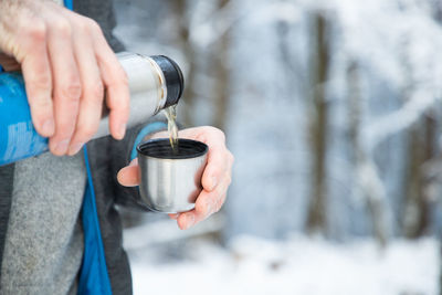 Man holding coffee cup