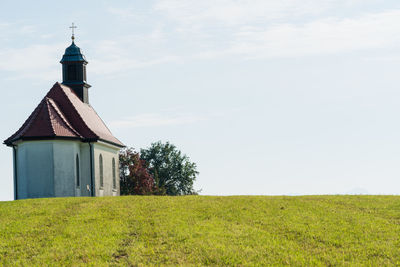 House on field against sky