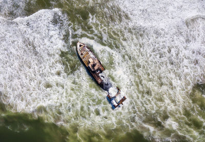 High angle view of man surfing in sea