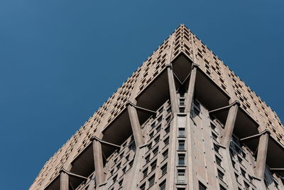 Low angle view of built structure against clear blue sky