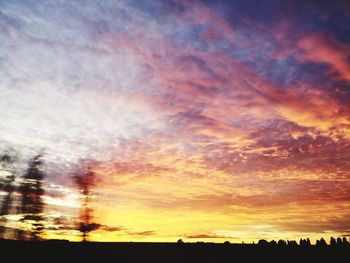 Low angle view of dramatic sky during sunset