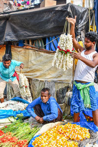Men at market stall