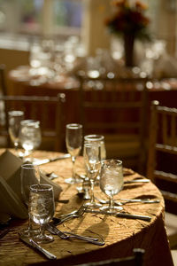 High angle view of wine glasses on table in restaurant