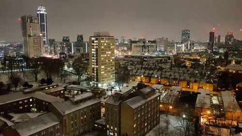 High angle view of illuminated cityscape against sky