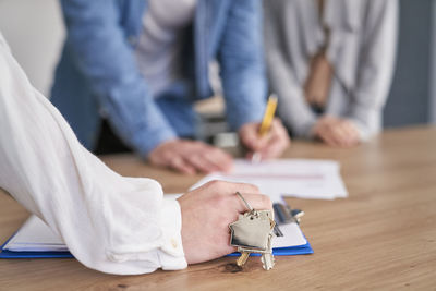 Midsection of business colleagues working at office