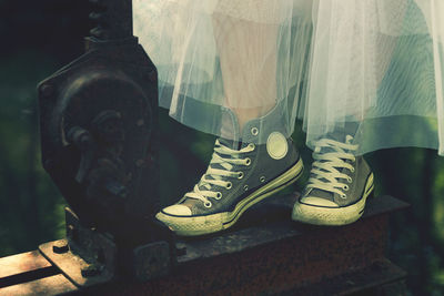 Low section of man wearing shoes