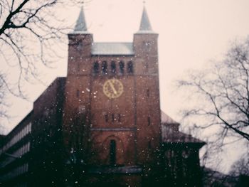 Close-up of built structure against sky during winter