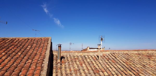 Roof of building against blue sky