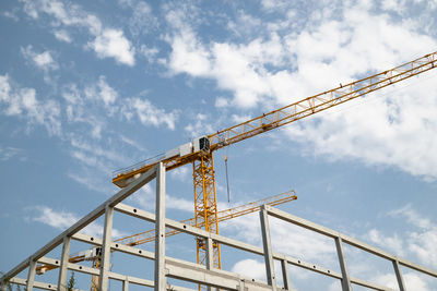 Low angle view of metal structure against sky