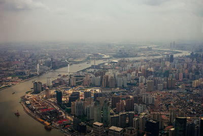 Aerial view of cityscape against sky