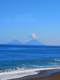 Scenic view of sea against blue sky