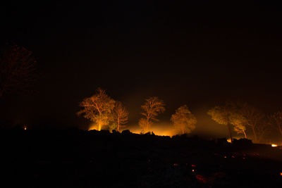 Scenic view of landscape against sky at night