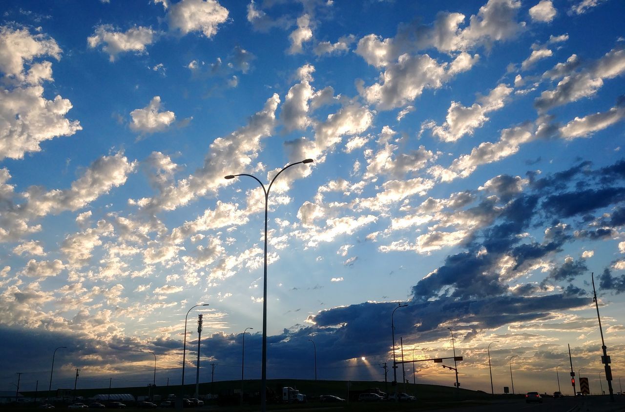 LOW ANGLE VIEW OF STREET LIGHT AGAINST SKY