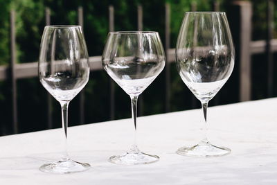 Close-up of wine glasses on table