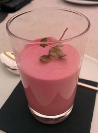 Close-up of pink drink on table