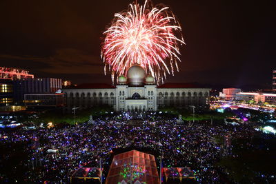 Firework display over palace of justice at night