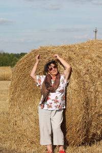 Full length of woman wearing hat on land