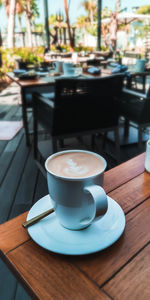 Coffee cup on table in cafe