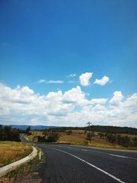 Empty country road along landscape